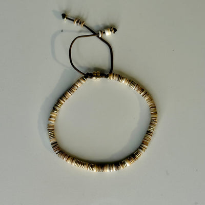 Silver Lining Bracelet in Natural Puka Shell with gold filled Beads on brown Cord